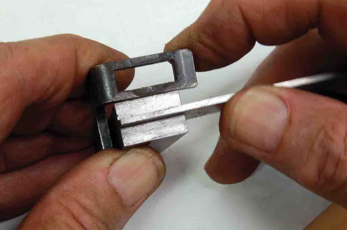 An inexpensive steel machinist’s square indicates when a sight frame is straight.